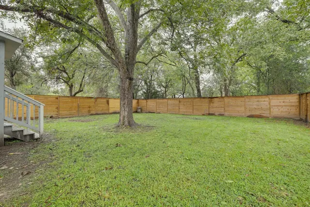 a view of backyard with green space