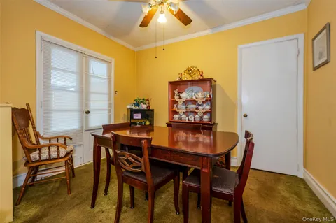 a dining room with furniture and window