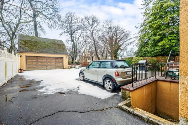 a front view of a house with parking yard