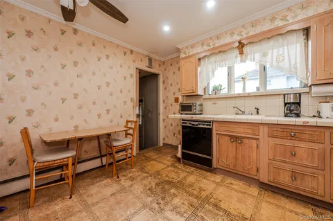 a kitchen with stainless steel appliances a stove a sink and a refrigerator