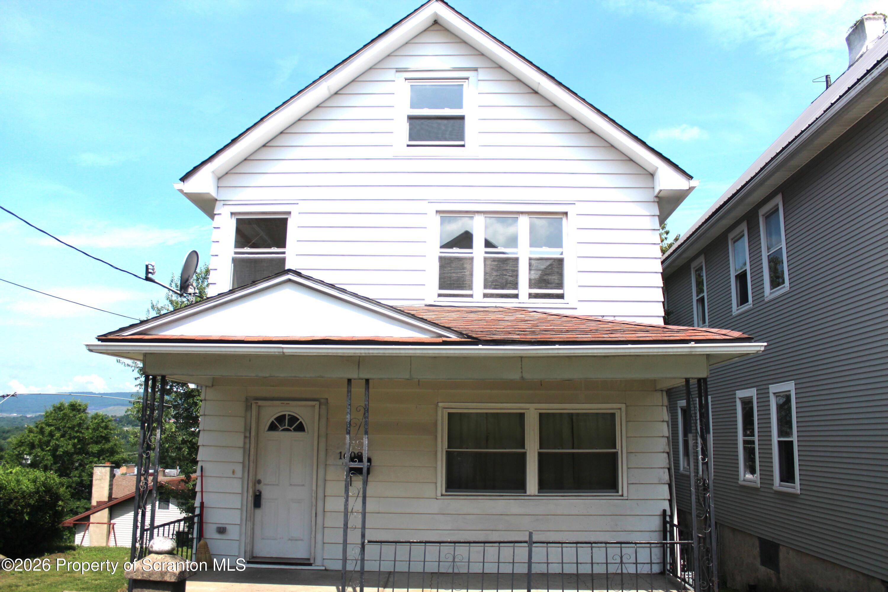 1608 Prospect Avenue Scranton, PA 18505 - Photo 1 of 30 a view of a white house with large windows