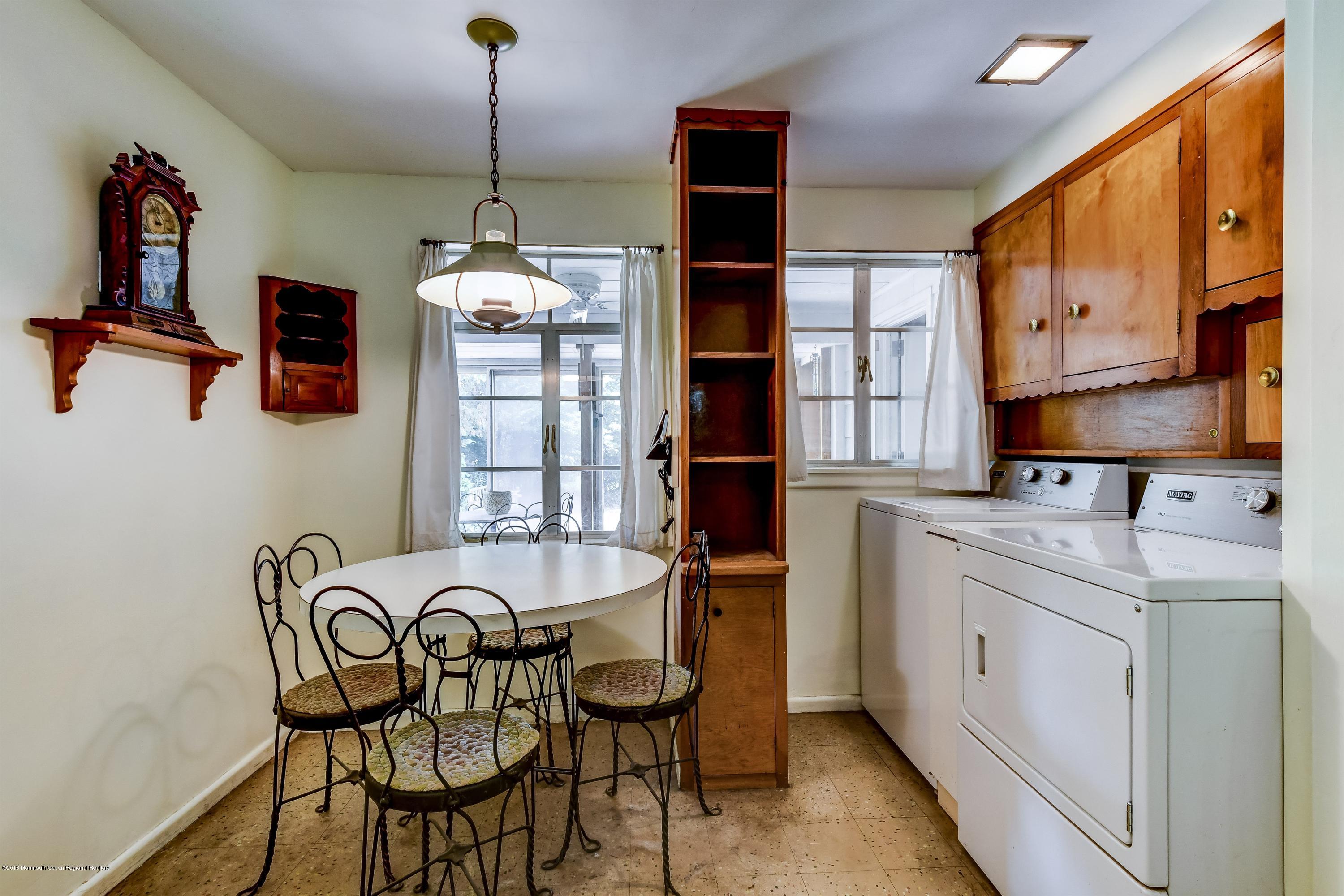 609 Locust Point Road Atlantic Highlands, NJ 07716 - Photo 12 of 23 a dining room with furniture and window