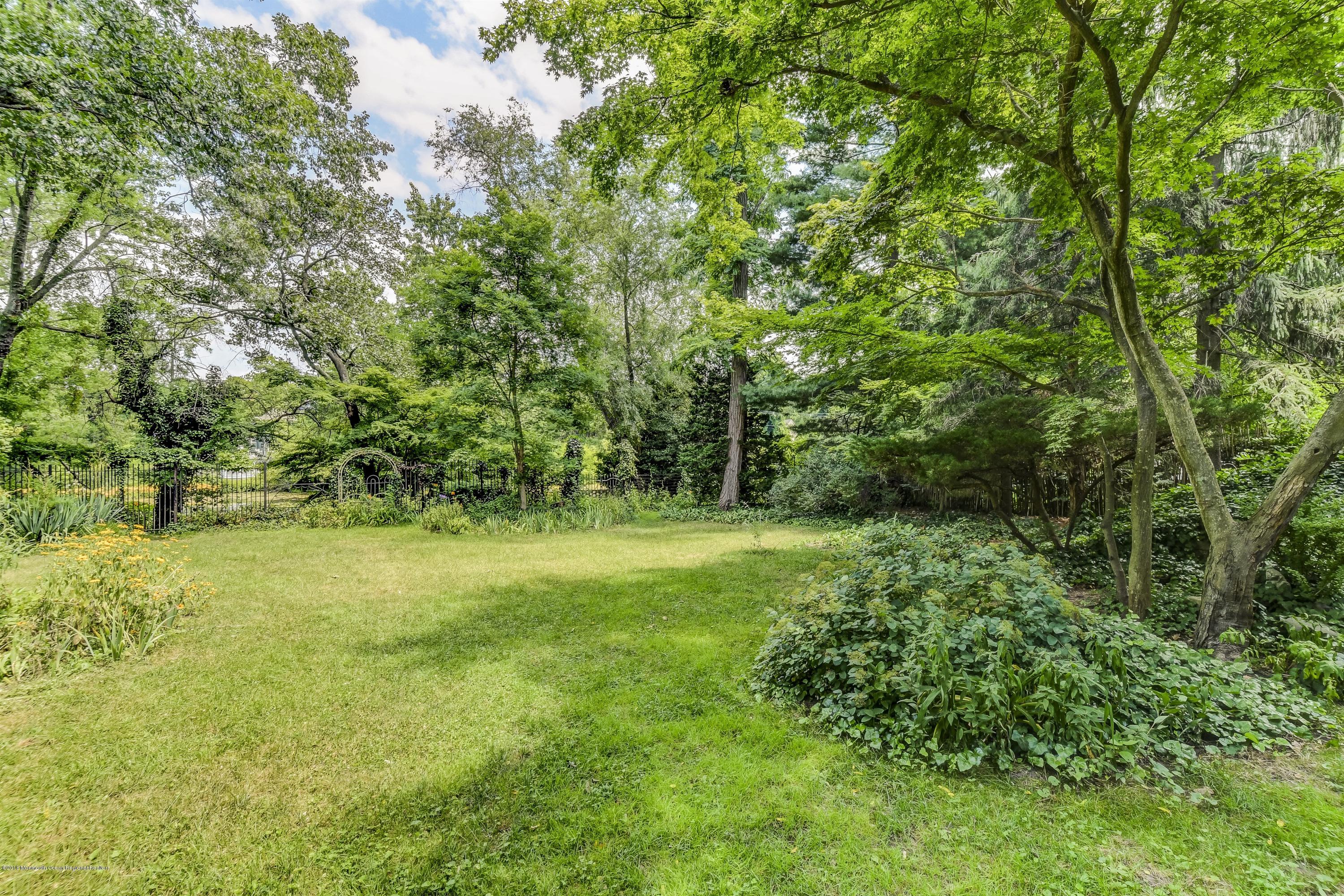 609 Locust Point Road Atlantic Highlands, NJ 07716 - Photo 23 of 23 a view of a yard with a tree