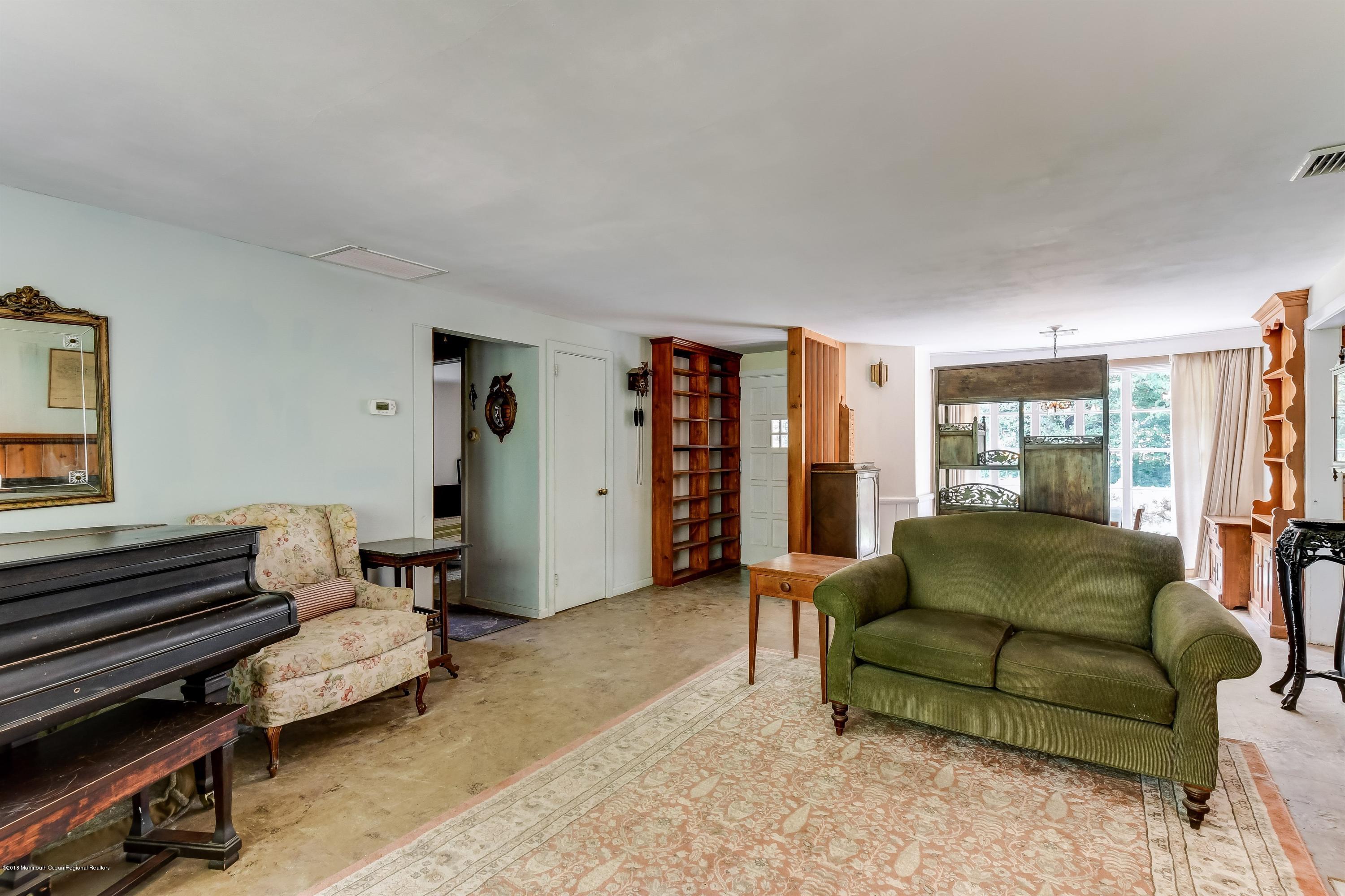 609 Locust Point Road Atlantic Highlands, NJ 07716 - Photo 4 of 23 a living room with furniture and a couch
