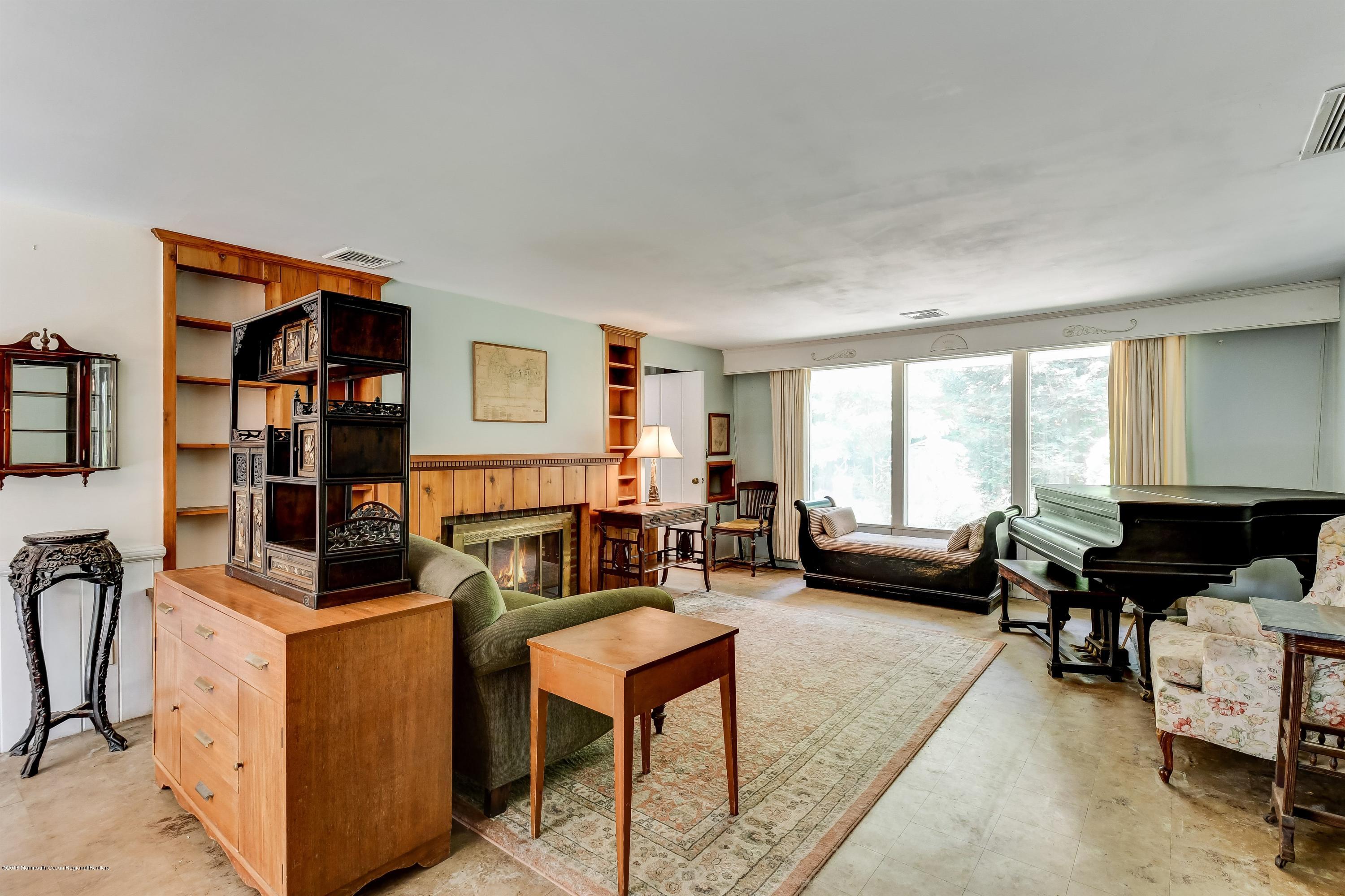 609 Locust Point Road Atlantic Highlands, NJ 07716 - Photo 5 of 23 a living room with furniture and a window