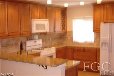 12180 Coyle Road Fort Myers, FL 33905 - Photo 5 of 8 a bathroom with a sink and a mirror