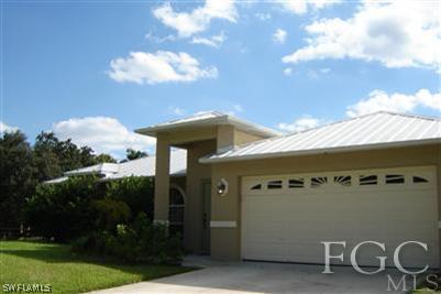 12180 Coyle Road Fort Myers, FL 33905 - Photo 7 of 8 a front view of a house with garden
