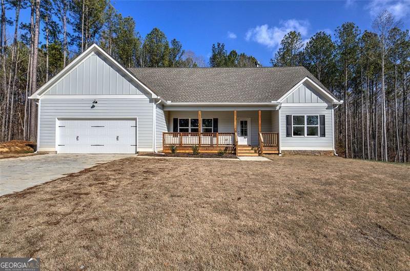 148 Rivers Edge Chatsworth, GA 30705 - Photo 1 of 1 a front view of a house with a yard and garage