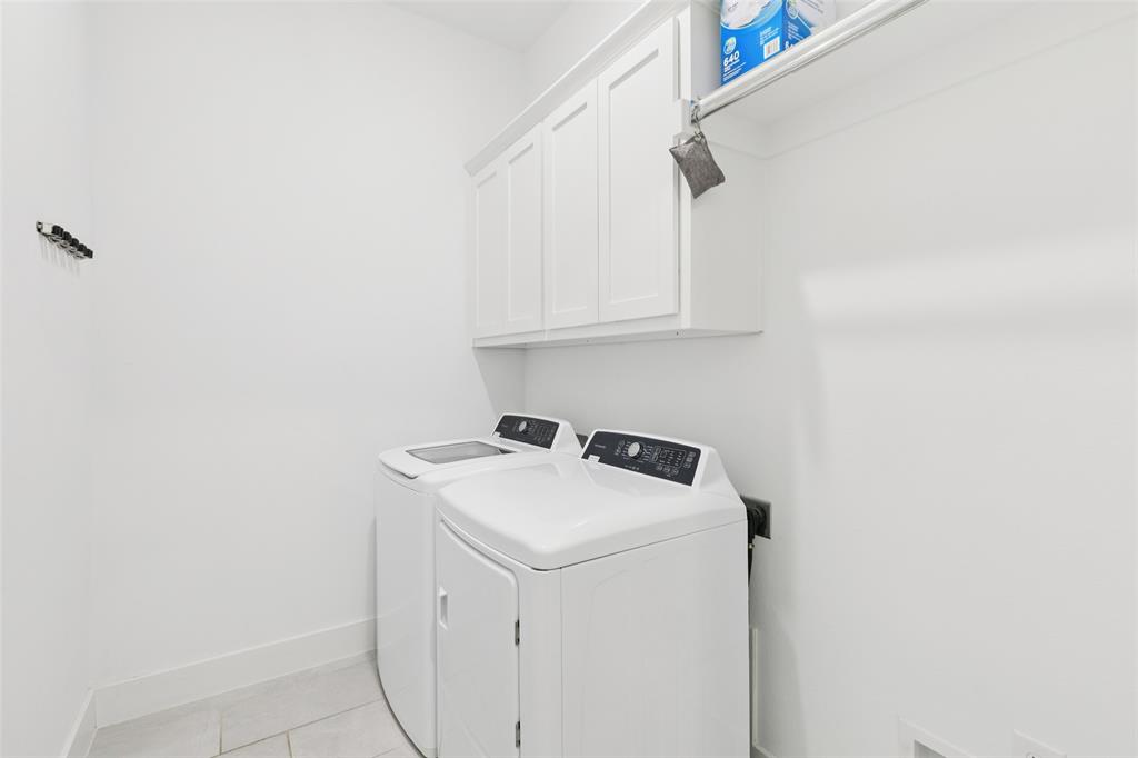 4313 Expedition Drive Oak Point, TX 75068 - Photo 17 of 40 a utility room with dryer and washer