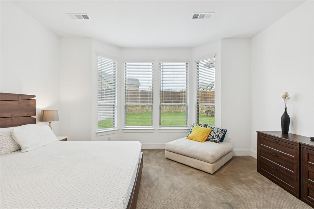 4313 Expedition Drive Oak Point, TX 75068 - Photo 19 of 40 a bedroom with a bed and a couch