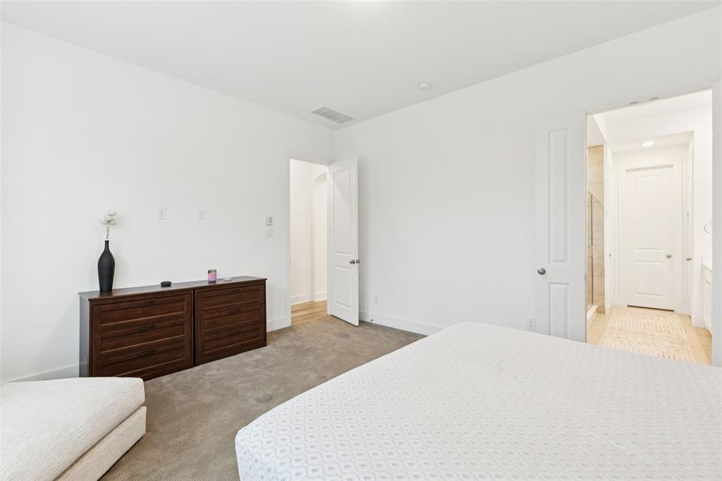 4313 Expedition Drive Oak Point, TX 75068 - Photo 20 of 40 a bedroom with a bed and a dresser