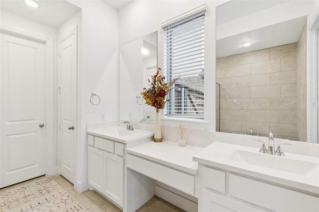 4313 Expedition Drive Oak Point, TX 75068 - Photo 22 of 40 a bathroom with a sink and a mirror