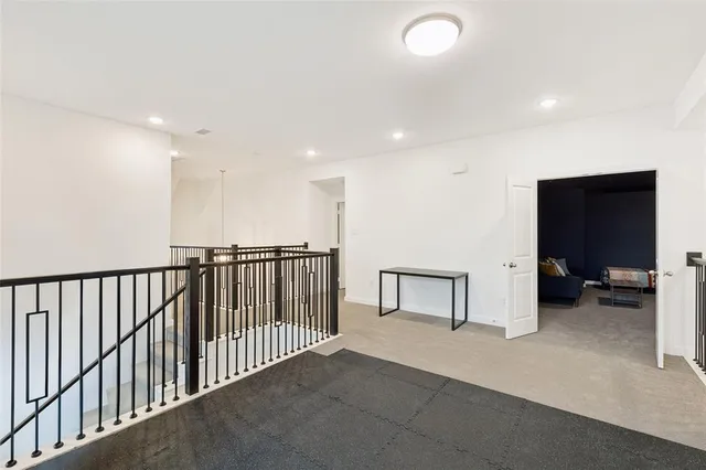 a view of a hallway with seating area