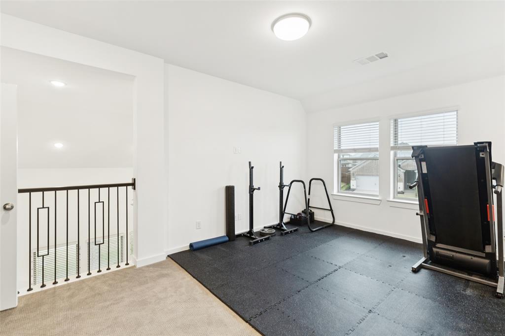 4313 Expedition Drive Oak Point, TX 75068 - Photo 25 of 40 a view of a livingroom with furniture and a window