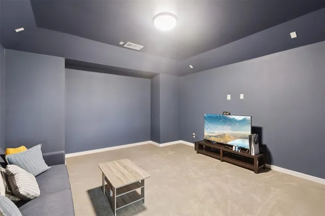 a room with furniture and a flat screen tv