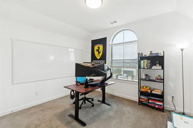 a workspace with furniture and window