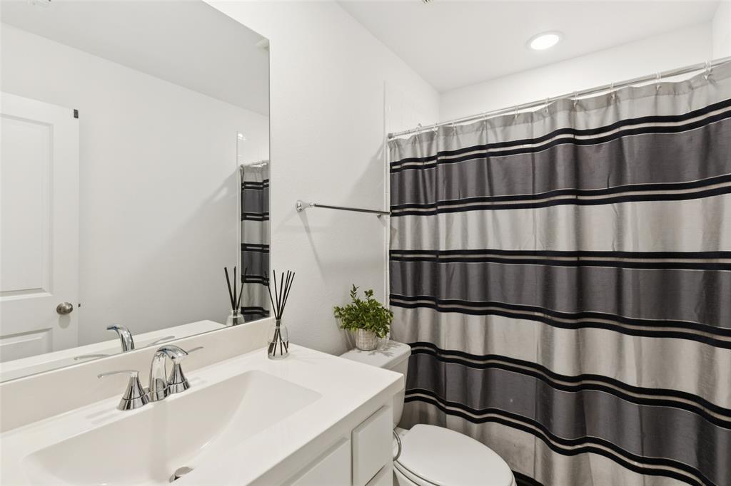 4313 Expedition Drive Oak Point, TX 75068 - Photo 30 of 40 a bathroom with a sink and a mirror
