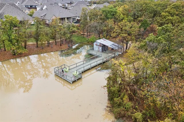 an aerial view of a house with yard swimming pool and outdoor seating