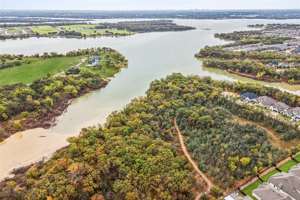 4313 Expedition Drive Oak Point, TX 75068 - Photo 39 of 40 a view of a lake with a mountain
