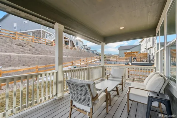 a view of a balcony with furniture