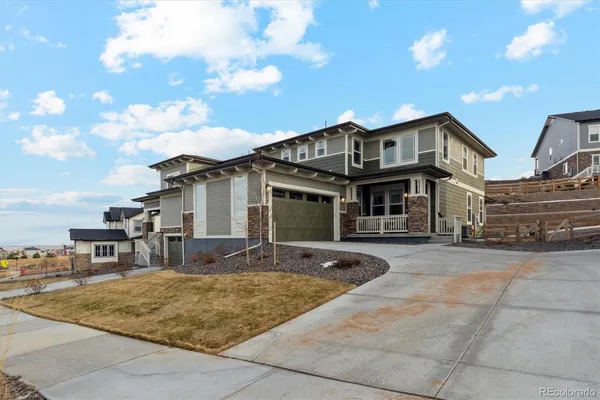 a front view of a house with yard porch and seating space