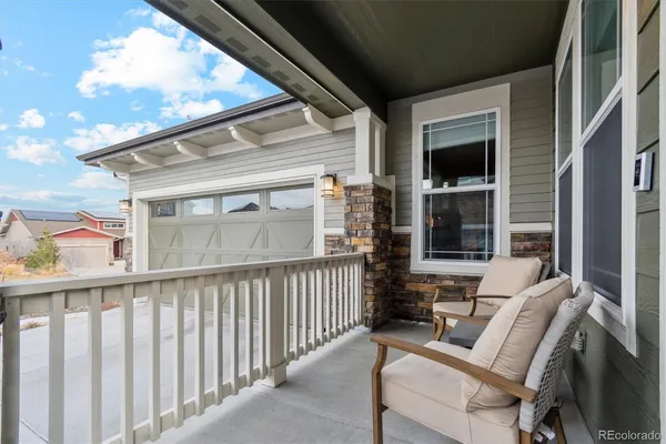 a view of balcony with furniture