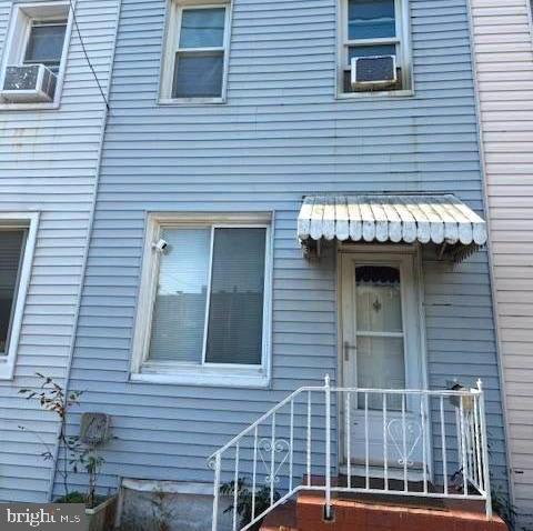 a view of a brick house with a large windows