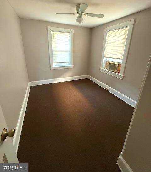 407 Cambria Street Baltimore, MD 21225 - Photo 12 of 13 an empty room with a window