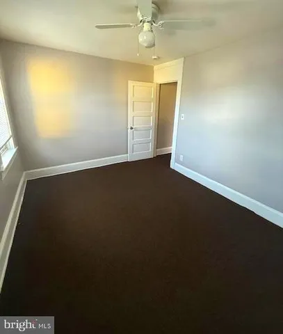 an empty room with a empty space and windows