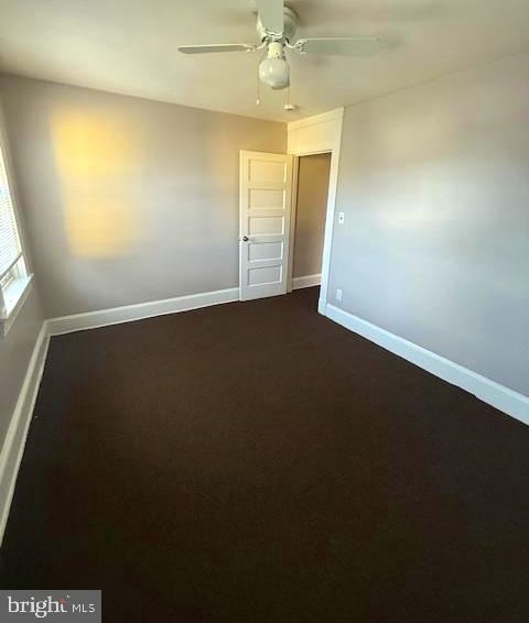 407 Cambria Street Baltimore, MD 21225 - Photo 6 of 13 an empty room with a empty space and windows
