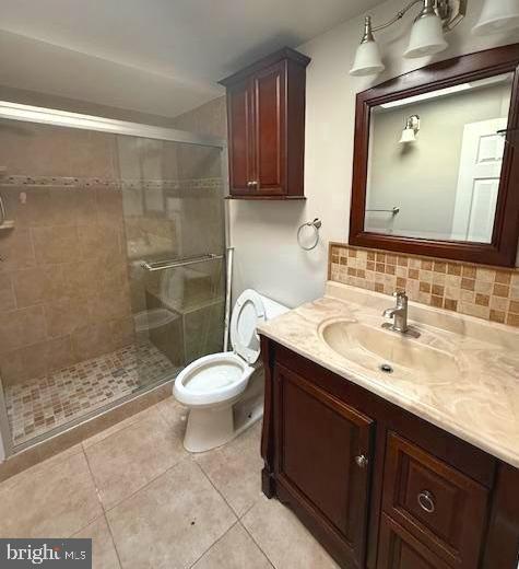 407 Cambria Street Baltimore, MD 21225 - Photo 8 of 13 a bathroom with a sink a toilet and shower