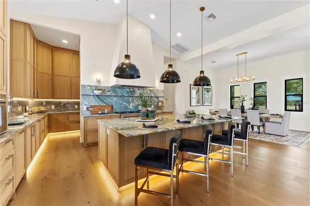 a room with a couch and a painting on the wall