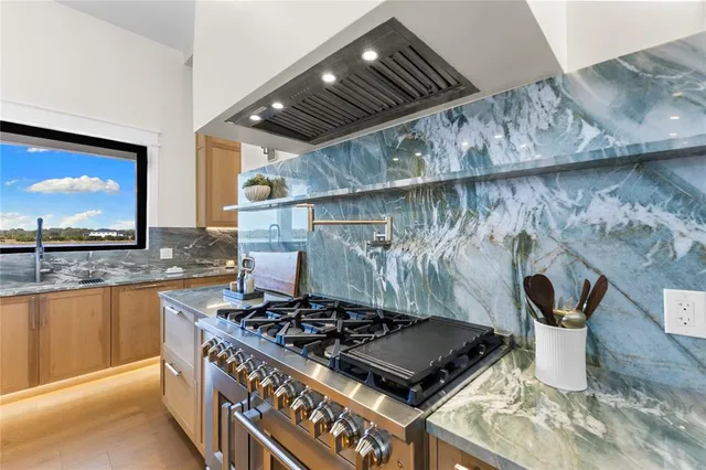 a bathroom with a sink a mirror and a shower