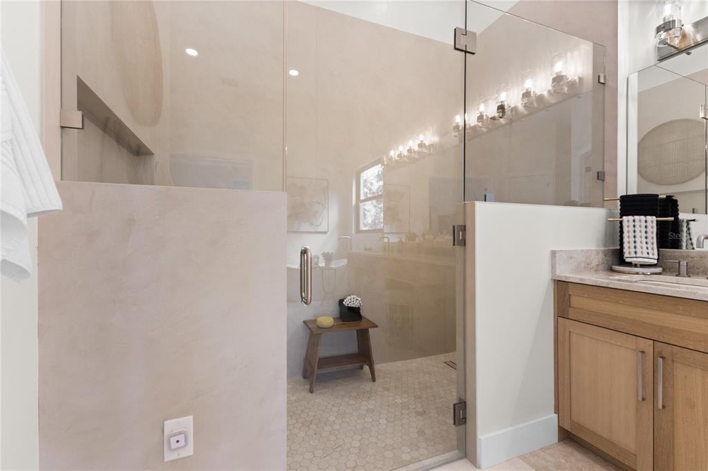 4940 Wauchula Road Myakka City, FL 34251 - Photo 31 of 77 a bathroom with a sink a mirror and a shower