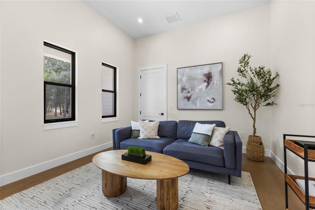 4940 Wauchula Road Myakka City, FL 34251 - Photo 34 of 77 a living room with furniture and a potted plant