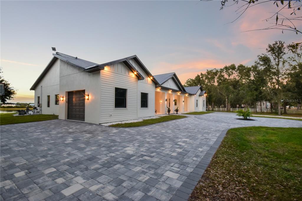 4940 Wauchula Road Myakka City, FL 34251 - Photo 4 of 77 a view of a house with backyard and tree s