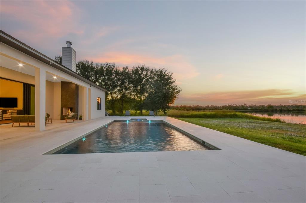 4940 Wauchula Road Myakka City, FL 34251 - Photo 71 of 77 a view of a swimming pool with an outdoor seating