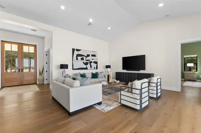a kitchen with stainless steel appliances granite countertop a stove and a refrigerator