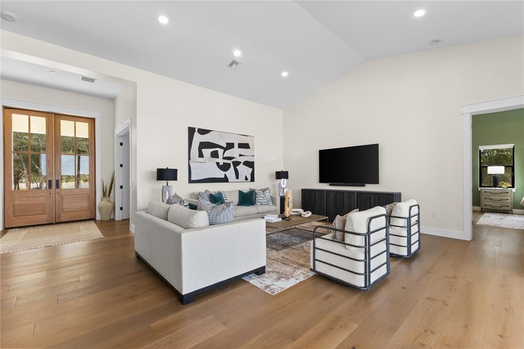 4940 Wauchula Road Myakka City, FL 34251 - Photo 9 of 77 a living room with furniture and a flat screen tv