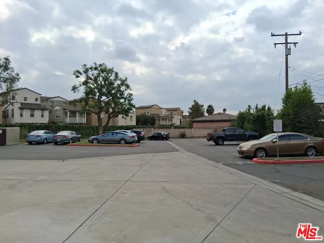 a view of street with parked cars