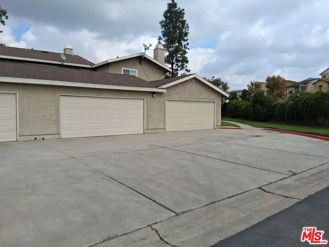 a view of garage and yard