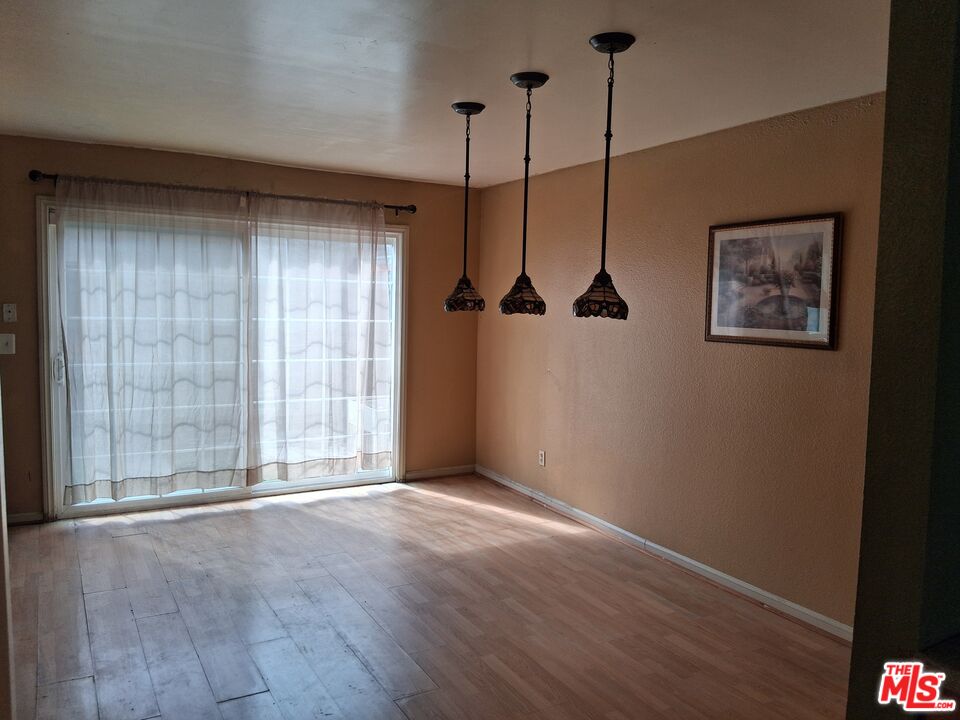 4195 Kingsley Street, Unit 43 Montclair, CA 91763 - Photo 9 of 13 a view of an empty room with a window