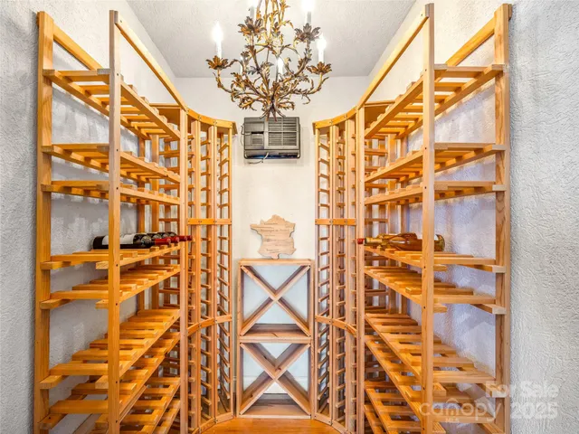 walk in closet with wooden floor