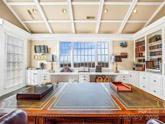 a kitchen with a stove and white cabinets