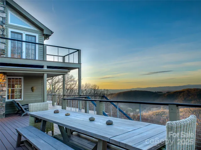 a view of roof deck with wooden floor and barbeque oven