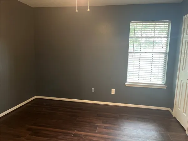 a white toilet and tub sitting next to a bathroom sink