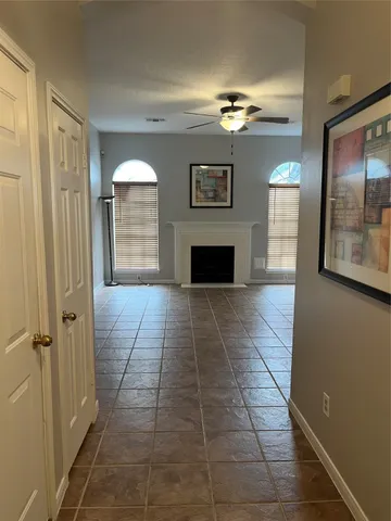 a view of livingroom with hardwood floor and kitchen view