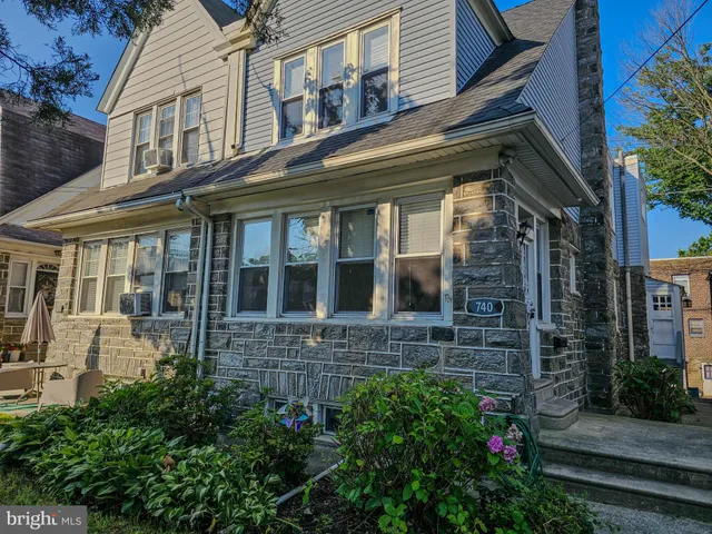 a view of brick building with large windows