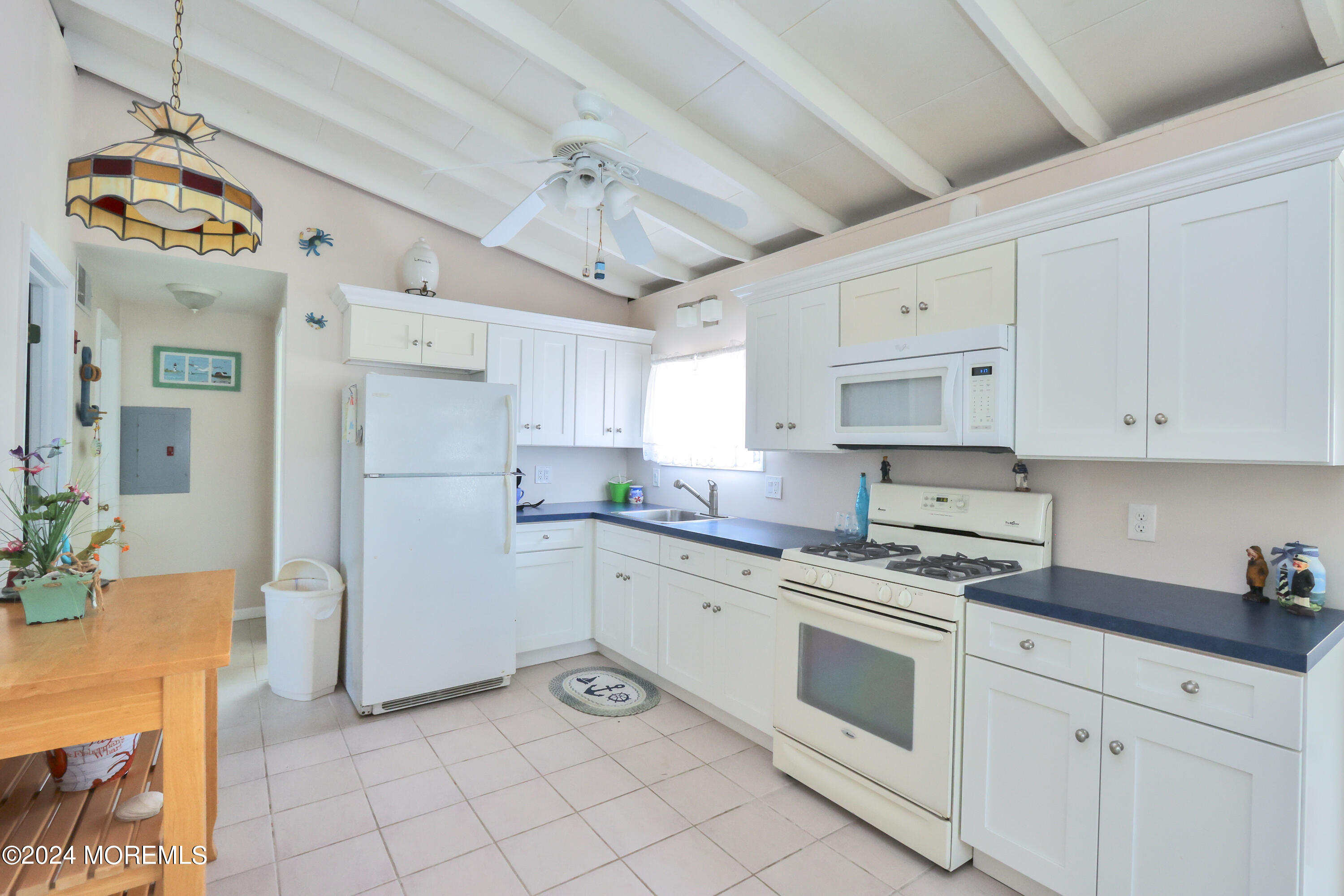 4 West Thames Road Little Egg Harbor, NJ 08087 - Photo 5 of 22 a kitchen with stainless steel appliances white cabinets and a refrigerator