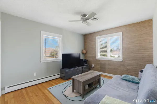 a living room with furniture and a window